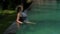 Beautiful Woman Swimming Pool At Resort Relaxed Portrait Young European Girl.