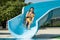 Beautiful Woman on Swimming Pool Slide