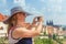 Beautiful woman takes pictores of the silhouette of Prague Castle