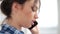 Beautiful woman talking mobile. Close up of speaking woman face with telephone. Smiling girl speaking phone. Pretty girl
