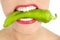 Beautiful woman teeth eating green pepper