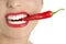 Beautiful woman teeth eating red pepper