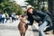 Beautiful woman touching cute deer at Nara Park