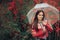 Beautiful Woman with Transparent Raincoat and Umbrella Enjoying Rain