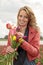 Beautiful woman with tulips in the fields