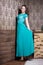 Beautiful woman in turquoise corrugated dress