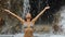 Beautiful woman under waterfall in the tropics