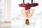 Beautiful woman using hammock for doing pose of antigravity yoga