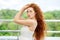 Beautiful woman with very long red hair. Concept of lifestyle, model, makeup