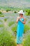 Beautiful woman walking alone in lavander fields