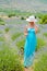 Beautiful woman walking alone in lavander fields