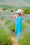 Beautiful woman walking alone in lavander fields