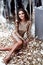 Beautiful woman wear skinny gold dress shiny sequins style