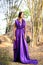 Beautiful woman wearing a long purple dress