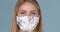 Beautiful woman wearing stylish face mask. Protection against viruses, pollution and dust