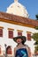 Beautiful woman wearing the traditional Colombian hat called Sombrero Vueltiao at the historical Calle de la Ronda of the