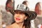 Beautiful woman wearing the traditional Colombian hat called Sombrero Vueltiao at the historical Calle de la Ronda of the