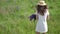 Beautiful woman in white dress and hat Walking Through Field Of Lupin Flowers. Video footage Full HD