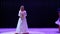 Beautiful woman in white long dress sing sensual song on the stage