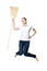 Beautiful  woman in a white T-shirt jumping holds a broom in her hands isolated on a white background