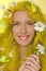Beautiful woman with yellow hair and daisies