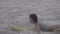 Beautiful woman with yellow surfboard on the beach