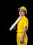 A beautiful woman in the yellow technician uniform holds a blueprint used in the construction