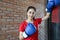 Beautiful women Asian boxer happy and fun fitness boxing and Punching A Bag With wearing boxing gloves