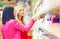 Beautiful women choose personal care product in supermarket