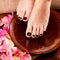 Beautiful women legs with black pedicure after Spa procedures