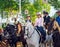 Beautiful Women riding horses and celebrating Seville`s April Fair, Seville Fair Feria de Sevilla.
