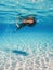 Beautiful Women Snorkeling in the Tropical Sea, Underwater Sandy Bottom