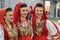 Beautiful women in traditional Albanian costumes posing for photo during annual Skopje festival of music and dance