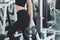 Beautiful women working out in gym alone with dumbbells. Healthy and Exercise lifestyle Concept