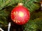 Beautiful wonderful new year holiday ball hanging on a xmas tree