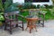Beautiful wooden benches for relaxation. picturesque area for relaxation. wooden furniture and flowers autdoor