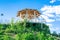 Beautiful wooden carved open alcove, arbor in city botanic park in spring summer sunny day against blue sky with bright