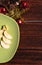 Beautiful wooden Christmas background with delicious food. Christmas card. A Christmas tree made of green Apple slices lies on a