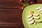 Beautiful wooden Christmas background with delicious food. Christmas card. A Christmas tree made of green Apple slices lies on a