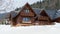 Beautiful wooden cottage covered in snow, ski resort Donovaly