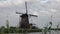 Beautiful wooden windmills at sunset in the Dutch village of Kinderdijk. Windmills run on the wind.