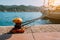 Beautiful yacht tied on the pier. Summertime feeling sunbeams, morning sunlight. Vacation on greek islands