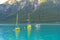 beautiful yachts, boats on picturesque lake Achensee in Austria, green mountains rises above calm expanse of water, concept of