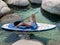 Beautiful yang lady relaxes on the paddle board