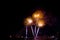 Beautiful yellow and green color firework display for celebration happy new year and merry christmas in the night sky, bangkok ci