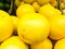 Beautiful yellow, orange natural sweet sour vitamin delicious ripe oblong bright lemons, fruits, citrus. Texture, background