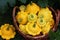 Beautiful yellow patissons in a basket on the grass