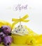 Beautiful yellow Spring or Easter theme cupcake with seasonal flowers tulips and decorations for the month of April