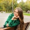 Beautiful yound woman portrait dressed in emerald green coat