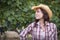 Beautiful Young Adult Female Portrait Wearing Cowboy Hat in Vineyard